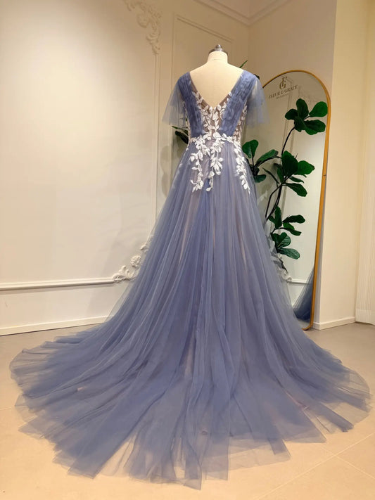 Dusty blue A-line wedding dress featuring a V-neck, flutter sleeves, and intricate white floral lace on flowing tulle.