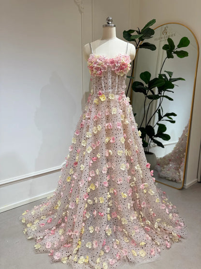 Alice Gown featuring pink and yellow 3D floral appliqués, beaded lace, sweetheart neckline, and a flowing court train.