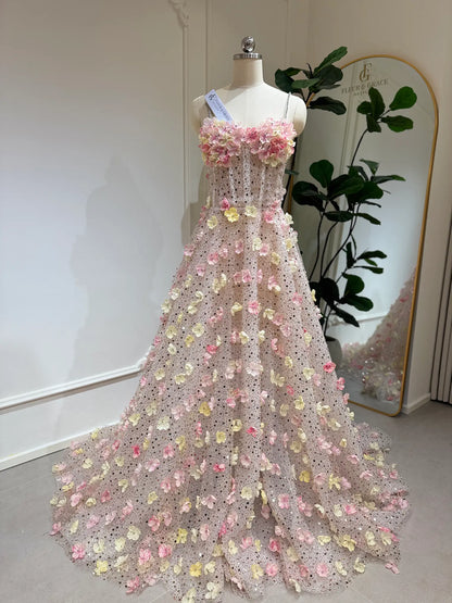 Alice Gown featuring pink and yellow 3D floral appliqués, beaded lace, sweetheart neckline, and a flowing court train.