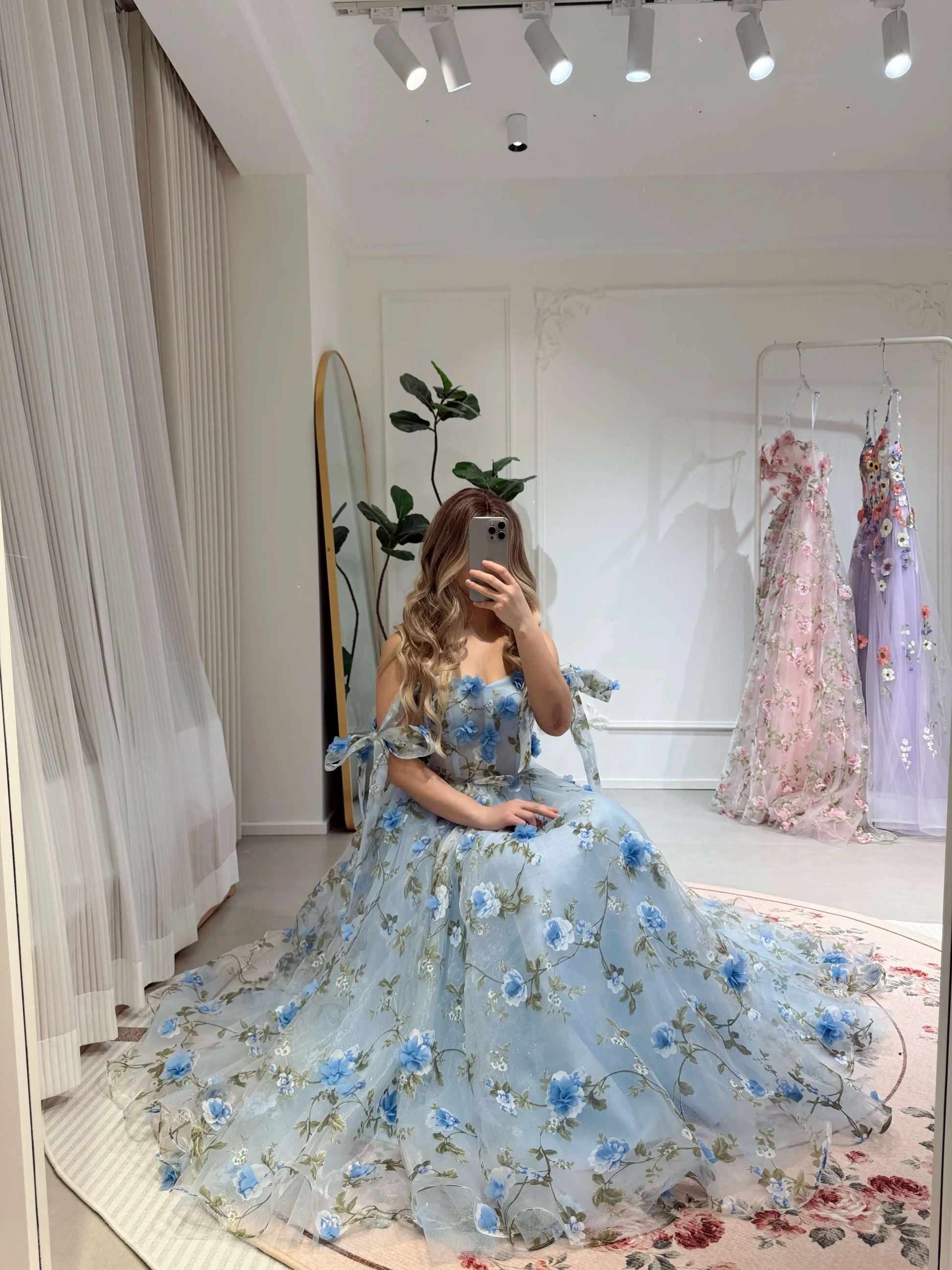 Blue ankle-length gown with 3D floral organza, sparkly mesh, sweetheart neckline, and lace-up back detail.