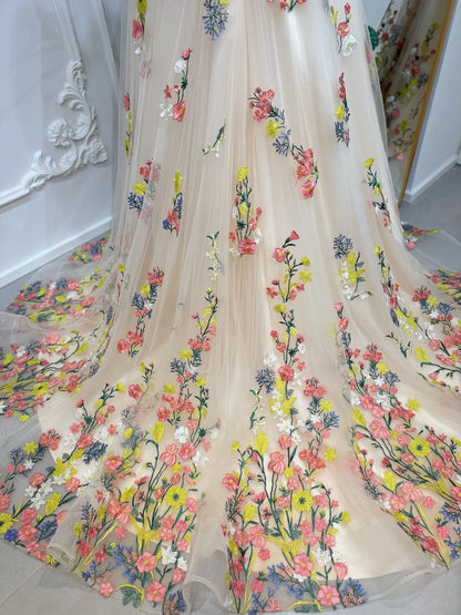 Champagne tulle wedding dress skirt with vibrant, hand-embroidered multicolor botanical floral appliqués.