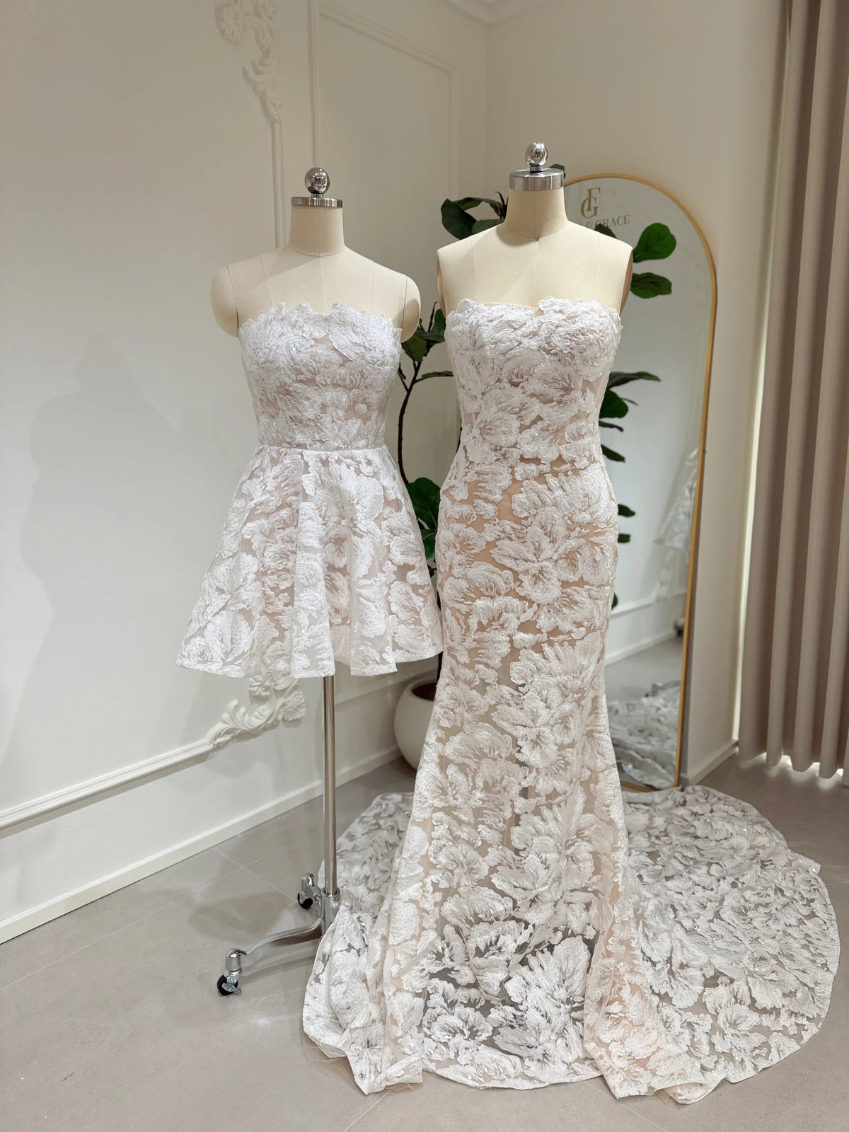 Strapless mermaid wedding dress with floral embroidery, glitter sequins, and a chapel train next to a matching mini dress.