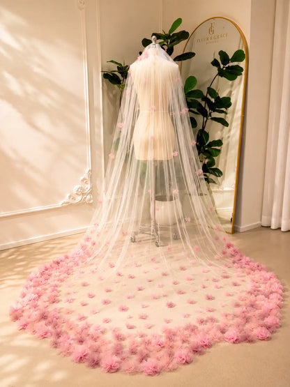 Cathedral-length bridal veil in soft illusion tulle featuring handmade blush pink 3D floral appliqués.