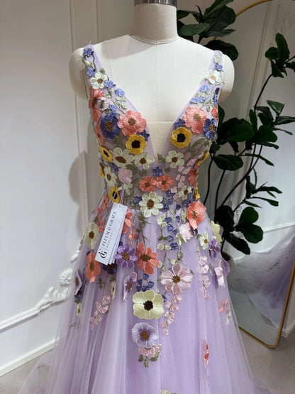 Lavender V-neck formal gown with sparkly tulle, a boned bodice, and colorful hand-sewn wildflower floral embroidery.