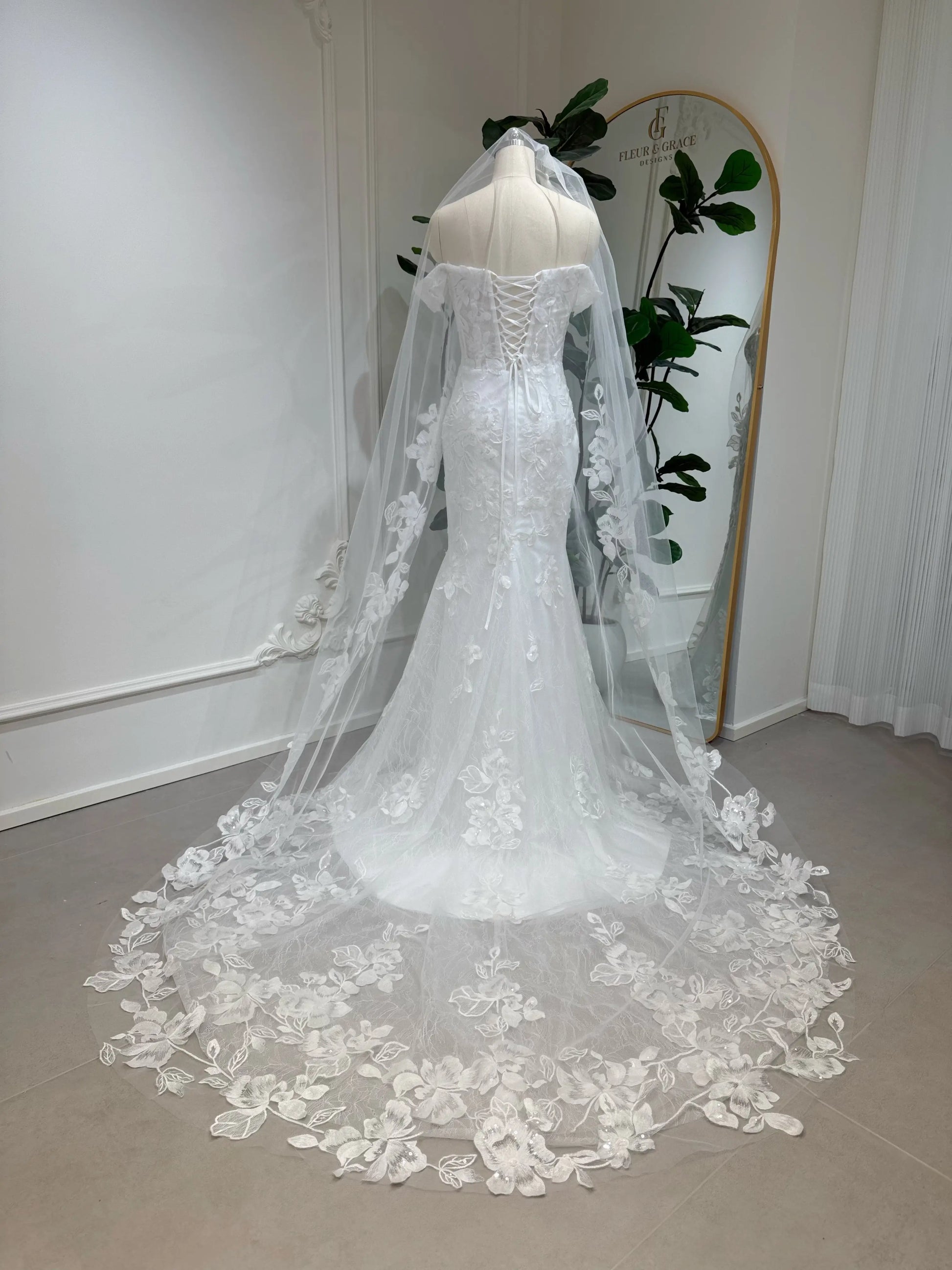 Lena lace cathedral veil with floral appliqué edge. Elegant bridal veil designed to match the Lena gown.