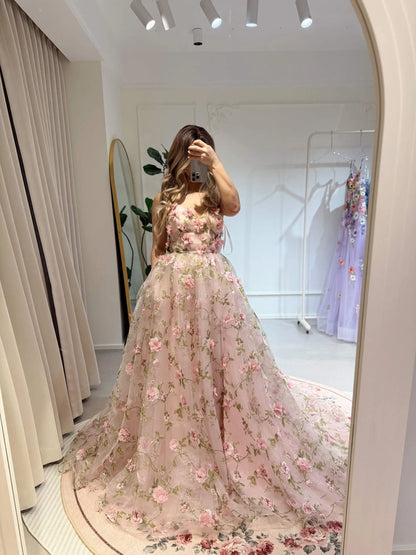 Pink 3D floral organza prom gown with sweetheart neckline, sparkly mesh, and green leaf embroidery in a mirror selfie.