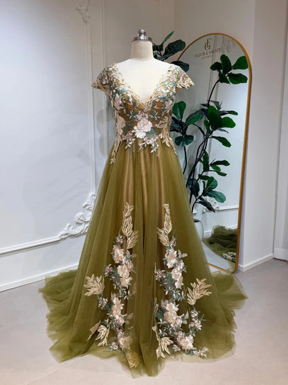 Olive green tulle wedding dress with V-neck bodice, floral embroidery, short sleeves, and a long chapel train.