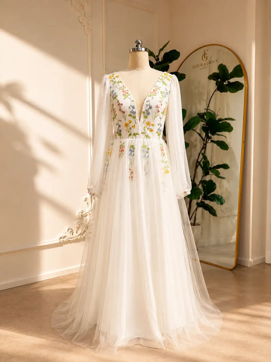 Stacey A-line wedding dress with pastel floral embroidery, V-neckline, and airy chiffon bishop sleeves on tulle.