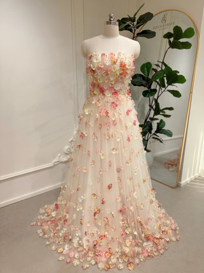 pink floor-length strapless dress with 3D floral appliqués, removable sleeves, lace-up back, and pockets, ideal for prom, wedding, and photography.