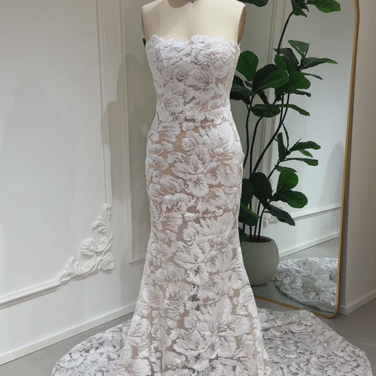 Mannequin wearing the Jane Gown by Fleur&Grace Designs – strapless mermaid wedding dress with floral embroidered lace, glitter sequins, lace‑up back, and chapel‑length train.