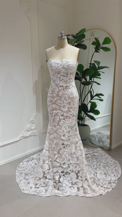 Mannequin wearing the Jane Gown by Fleur&Grace Designs – strapless mermaid wedding dress with floral embroidered lace, glitter sequins, lace‑up back, and chapel‑length train.