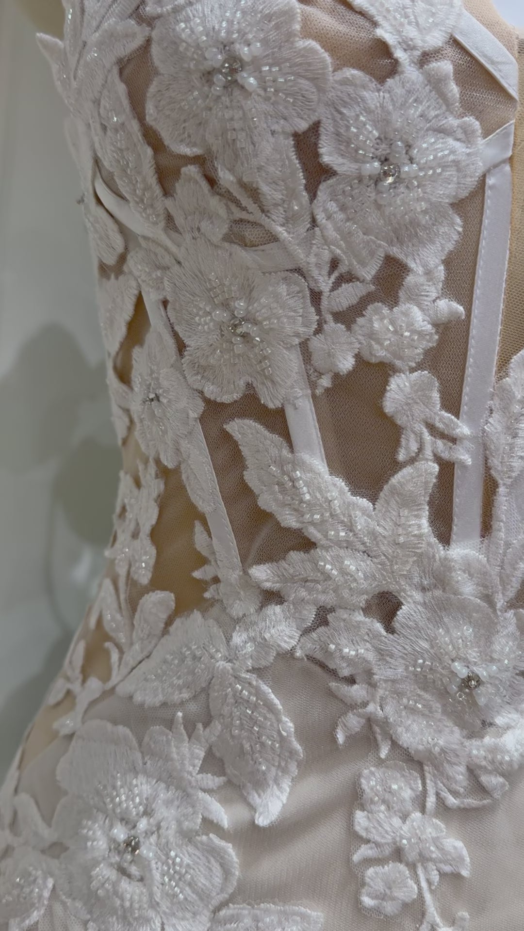 Tia Gown  by Fleur&Grace Designs — strapless mermaid wedding dress with basque waistline, sheer boned bodice, beige silk lining, ivory floral embroidery with beading, plunging V-neck, and court train.