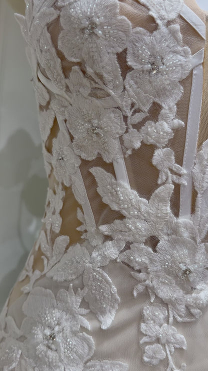 Tia Gown  by Fleur&Grace Designs — strapless mermaid wedding dress with basque waistline, sheer boned bodice, beige silk lining, ivory floral embroidery with beading, plunging V-neck, and court train.